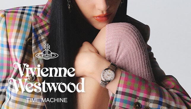Model wearing Vivienne Westwood unisex watch with red dial and gold bracelet, showcasing bold, fashion-forward style.